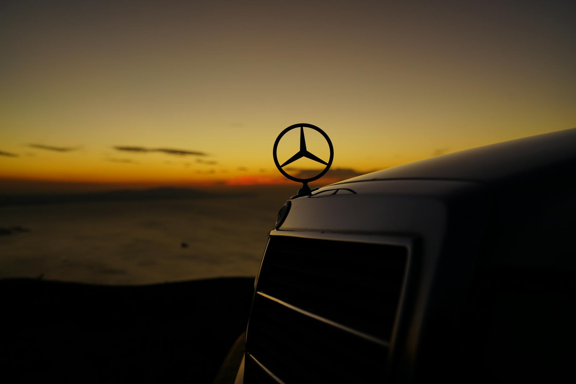 close up shot of a mercedes benz emblem